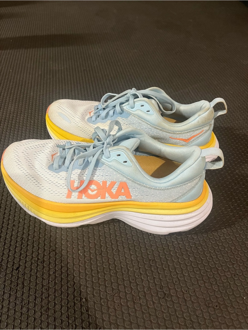 Hoka Light Blue and Yellow Sneakers with Orange Logo women’s size 8 gently used